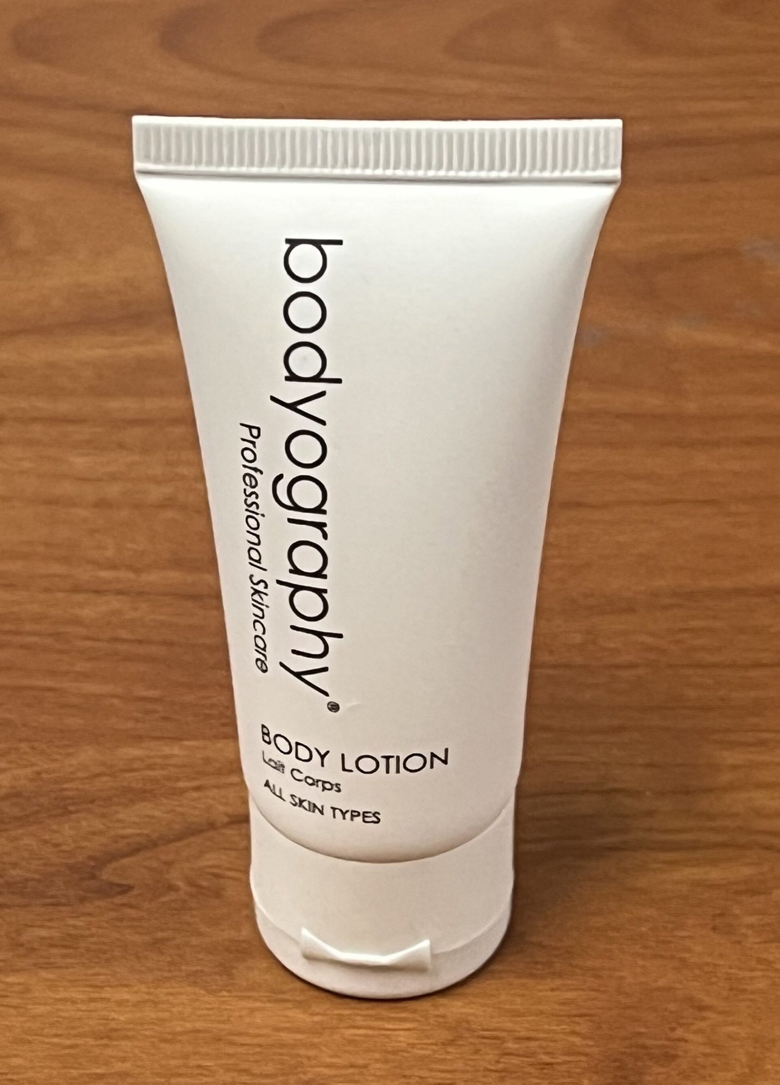 Bottle of unscented 1000mg CBD body lotion, light enough for arms and legs