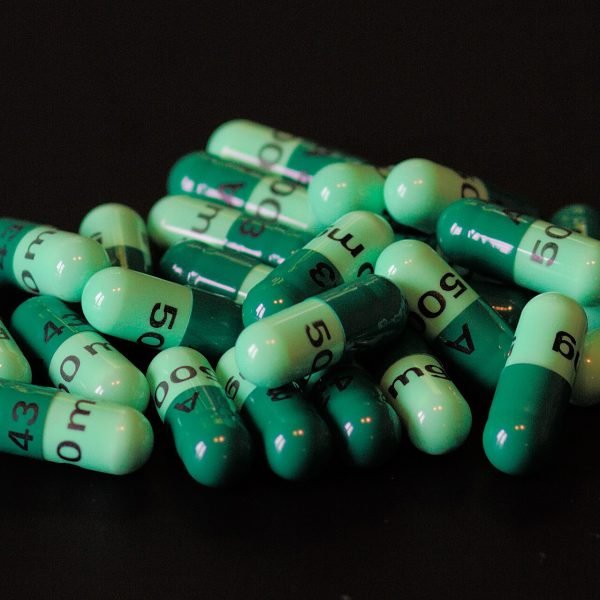 Bottle of full spectrum CBD softgels in 50 mg and 100 mg strengths